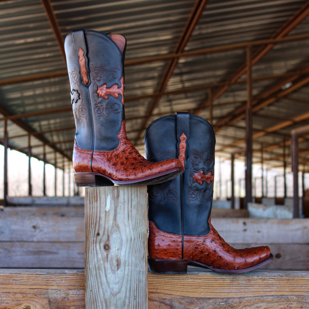 Mens congac leather western boots with narrow square toe and decorative stitching, featuring full-quill ostrich leather on the foot for added texture.